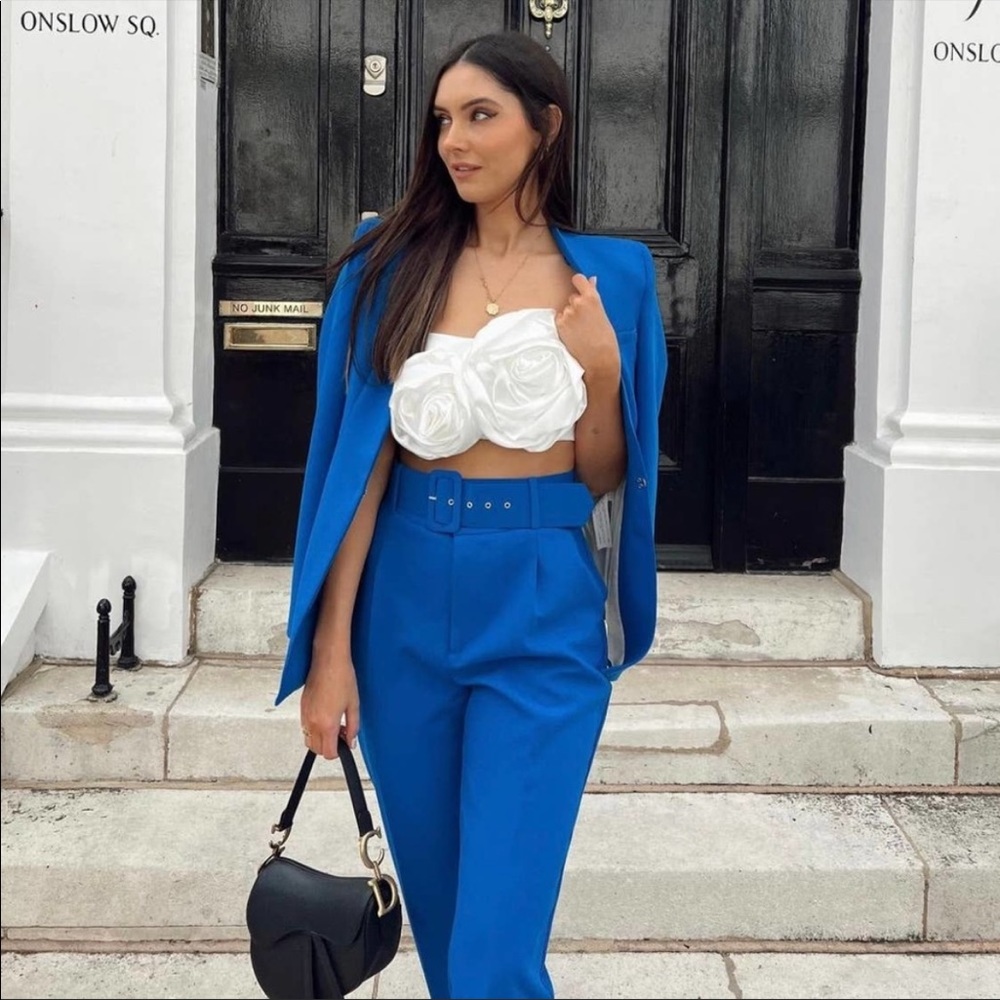 Pants with fabric-covered belt